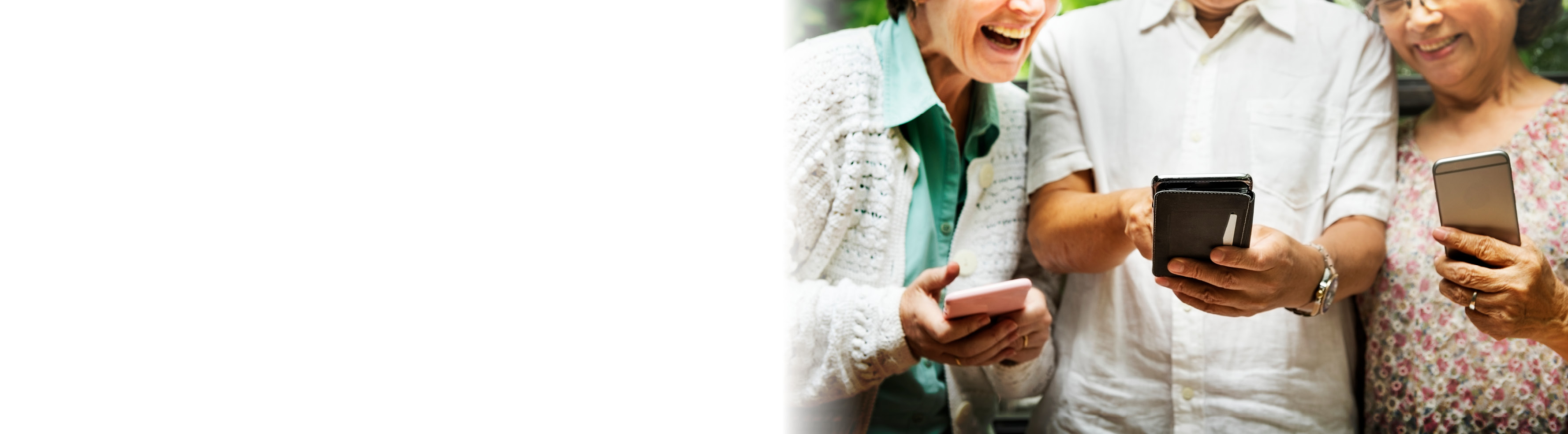 three people looking at phones