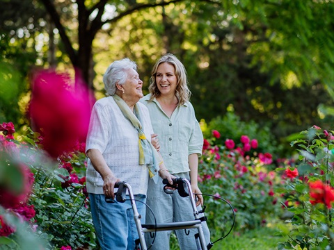 ladies walking in a garden