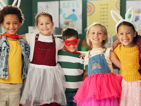 5 children in dress up smiling