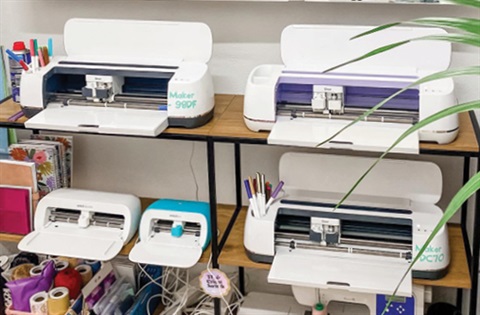 A range of cricut machines on shelves