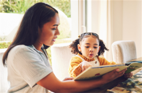 lady reading to child