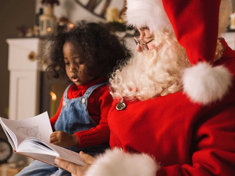 santa reading a book