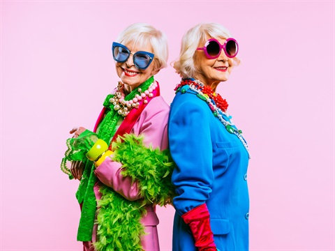 two seniors in bright clothes