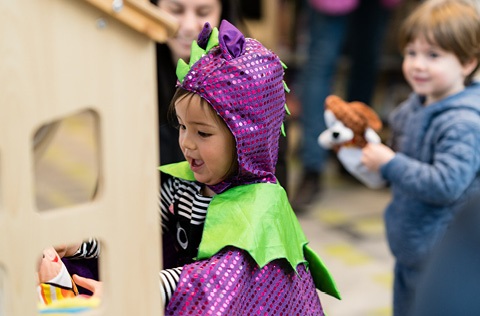 child dressed as a dragon