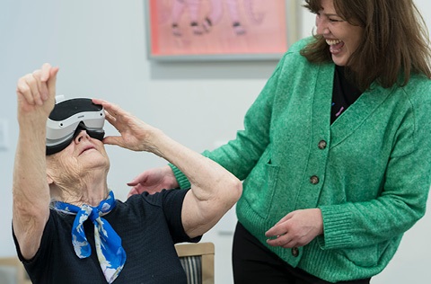 woman using VR goggles