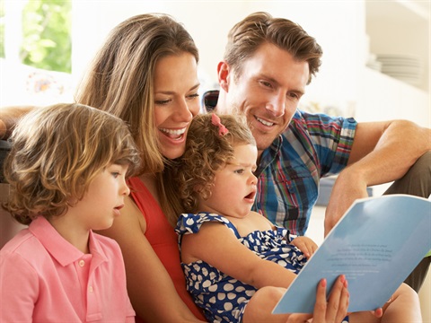 family reading a book