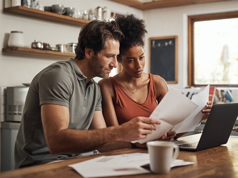 two people looking at their financials