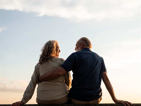 older couple watching a sunset