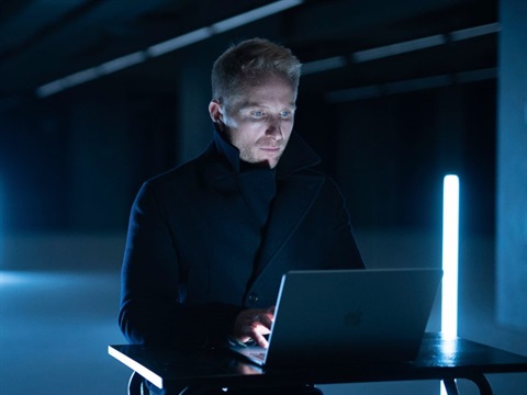 man looking at a computer