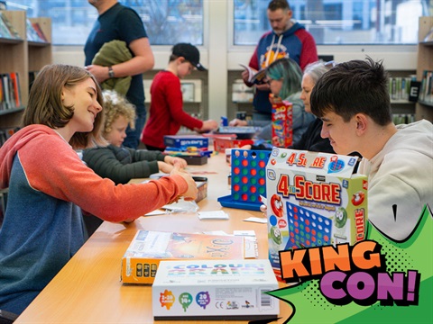 people playing board games