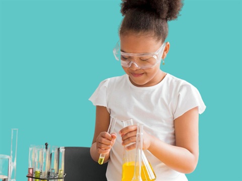 girl holding a science beaker