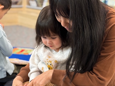 mother reading to a child