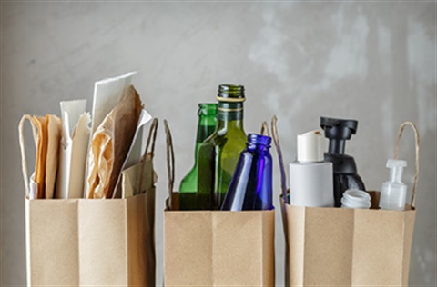 Bottles, containers and paper in paper bags